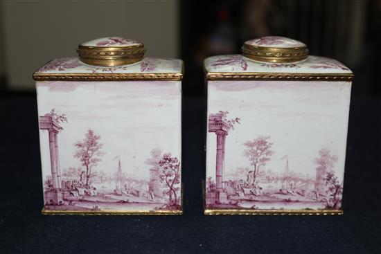 A pair of South Staffordshire enamel tea caddies and covers, and two similar candlesticks, late 18th century, 6.25in. and 10in., candle